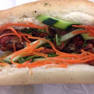 a sandwich with meat and vegetables