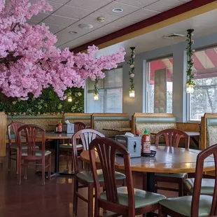 a dining area with tables and chairs