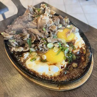 Grilled pork and pate on sizzling plate