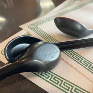 a spoon and spoon rest on a napkin