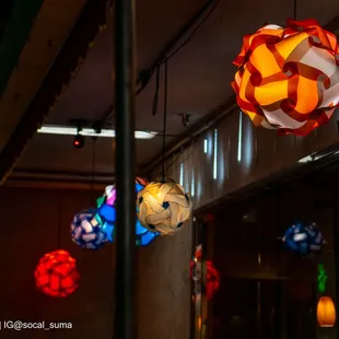 Business Exterior: Phở Lú decorates its sidewalk patio and front of business with lanterns and various hanging LED lights.