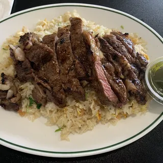 Rib Eye Over Fried Rice Plate