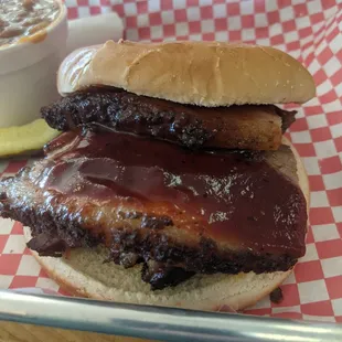 a bbq sandwich with a side of coleslaw