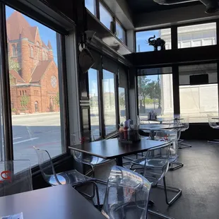 empty tables and chairs in a restaurant