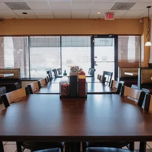 a dining room with tables and chairs