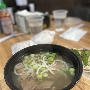 Pho served in plastic bowl