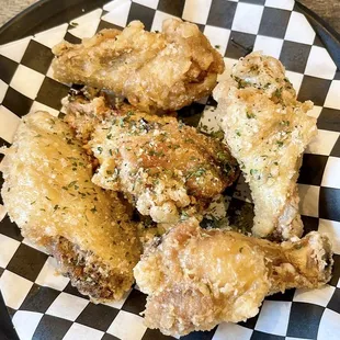a plate of fried chicken wings