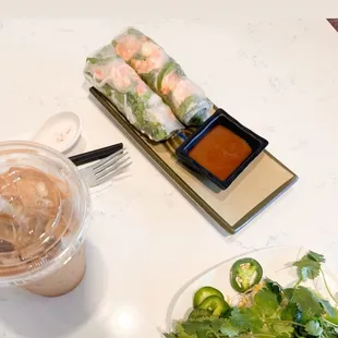 Shrimp spring roll and add in&apos;s of pho along with a Vietnamese coffee