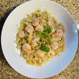 Shrimp fried rice with a side of salad