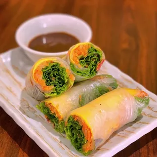 a plate of food with dipping sauce