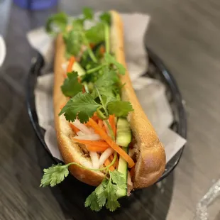 a hot dog in a basket on a table