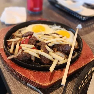 Sizzling stake,eggs and frys