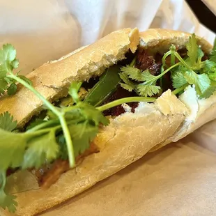 a sub sandwich with cilantro