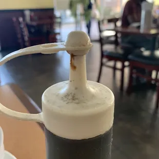 Sauce bottle on table