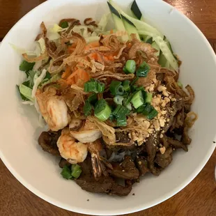 Grilled pork and prawns over vermicelli