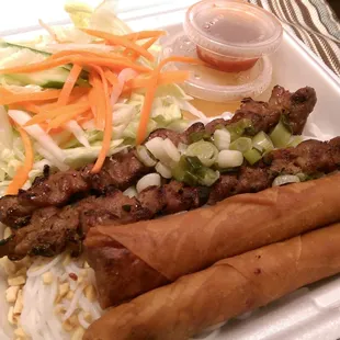 Pork vermicelli bowl with egg rolls to go.