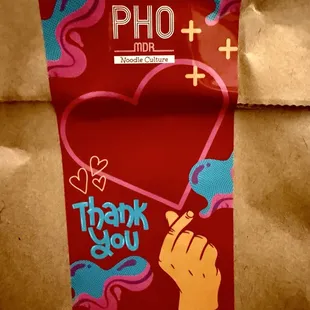 Cute sticker on the to-go bag! Veggie Pho to go!
