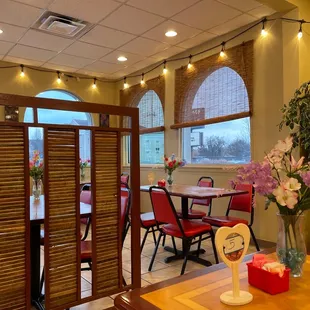 a dining area with tables and chairs