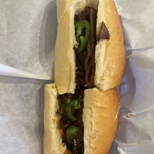 a sandwich with meat and vegetables