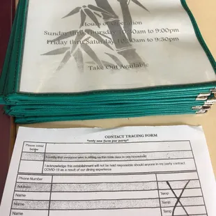 a stack of papers and a receipt