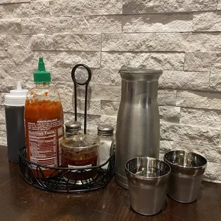 Water carafe, cups and condiments