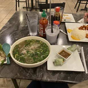  a bowl of soup and a plate of rice