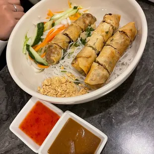  a plate of food with dipping sauces