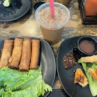 left: vegetable A2. Crispy Veggie Egg Rolls right: A6. Crispy Fried Tofu middle: Vietnamese Iced Coffee (W/ Boba)