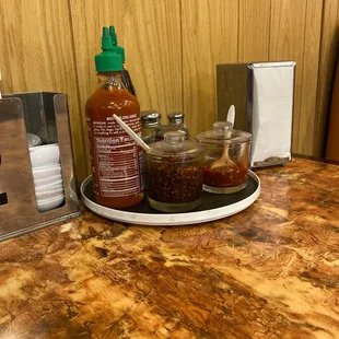 2 types of chili paste beside hoisin sauce and shiracha sauce