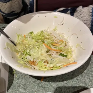 Rice noodle with pork. Mostly iceberg lettuce. Pork was clearly pre-cooked awhile ago and microwaved to serve.