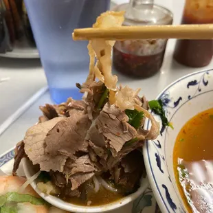 a bowl of soup and a sandwich