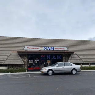 a car parked in front of a restaurant
