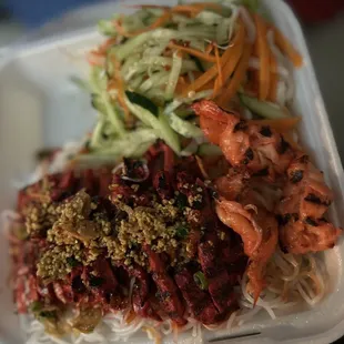 Chicken noodle bowl and extra shrimp with side of radish, cucumber, carrots and bean sprouts