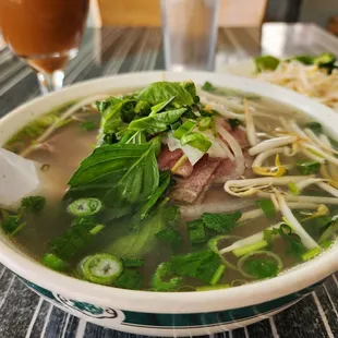 Pho with raw beef slices (small) and Thai iced tea