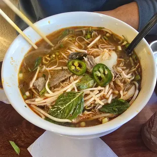 #1 Pho and large size. We put 2 spoons of pepper there, and it's spicy. The broth was so delicious. The size of the bowl is huge!