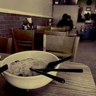  bowl of noodles and chopsticks