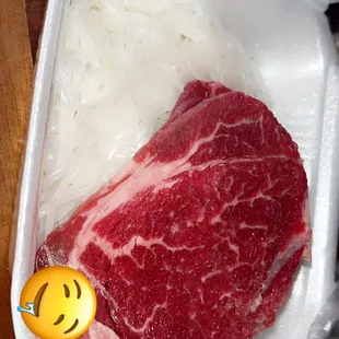  piece of meat in a styrofoam container