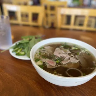 a bowl of soup and a glass of water