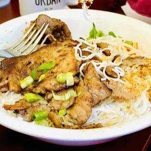 a plate of food with rice and meat