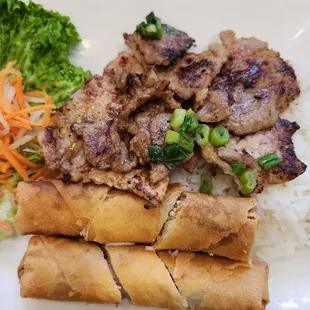 Grilled pork and egg rolls on rice