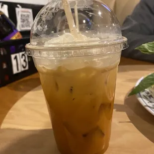 a plastic cup of iced coffee