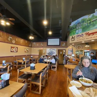 a woman eating in a restaurant