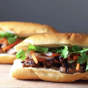 two sandwiches on a cutting board