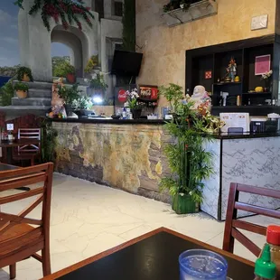 a restaurant with tables and chairs