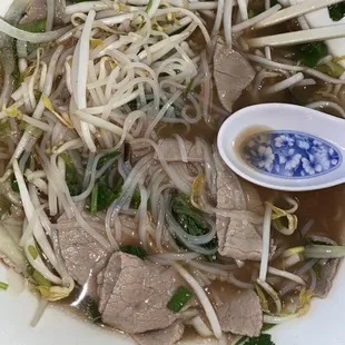 I put the whole plate of toppings in it lol  jalapeños, lime, bean sprouts and basil ALL IN