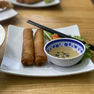 One order of Vietnamese egg rolls comes with two pieces and a delicious fish dipping sauce