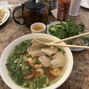 Clear Rice Noodle Soup Topped with Shrimp and Slices of Pork Loin and Jasmine Tea