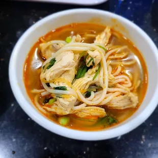 a bowl of soup with noodles