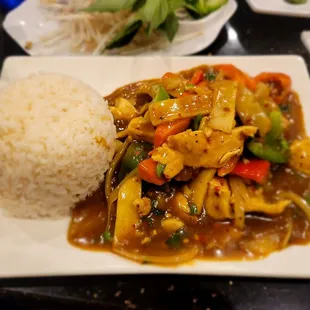 a plate of food with rice and vegetables