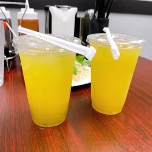 two glasses of juice on a table